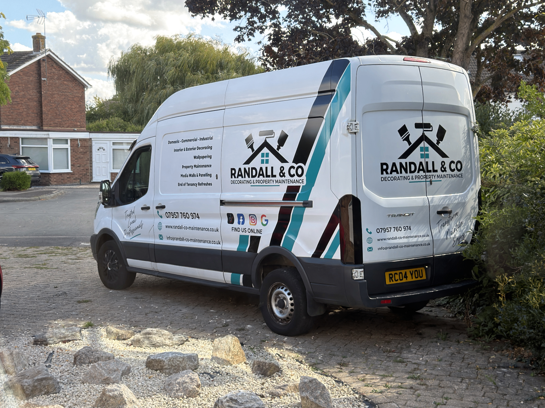 Randall & Co branded van in white, black, turquoise and red
